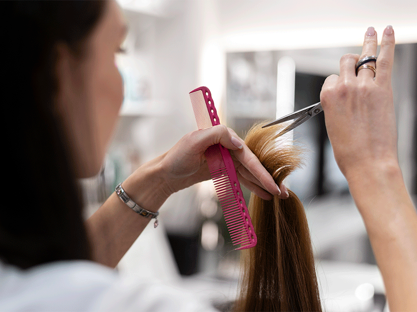 woman-getting-her-hair-cut-beauty-salon